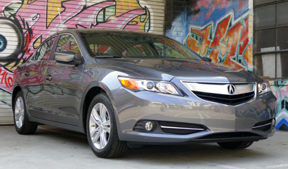 A three-quarter front view of a 2013 Acuara ILX Hybrid