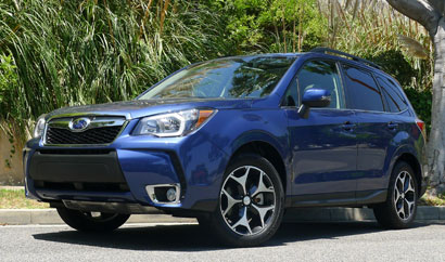 A three-quarter front view of a 2014 Subaru Forester 2.0XT