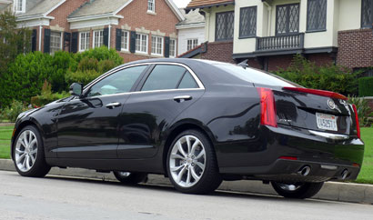 A three-quarter rear view of a 2013 Cadillac ATS 2.0T Premium Collection