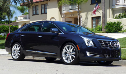 A three-quarter front view of the 2013 Cadillac XTS AWD Premium Collection