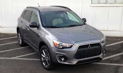 A three-quarter front view of the 2013 Mitsubishi Outlander Sport LE 2WD