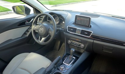 An interior view of the 2014 Mazda 3 i 4-Door Touring