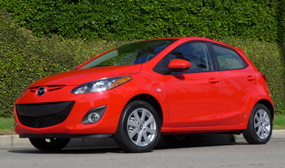 A three-quarter front view of the 2014 Mazda 2 Touring