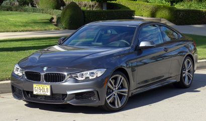 A three-quarter front view of the 2014 BMW 435i Coupe