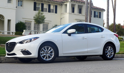 A side view of the 2014 Mazda 3 i 4-Door Touring