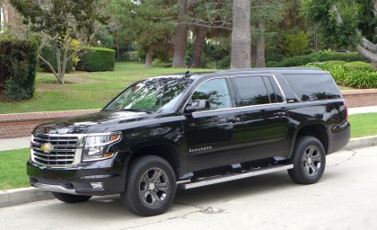 A three quarters front view of the 2015 Chevrolet Suburban 4WD 1/2 Ton LT