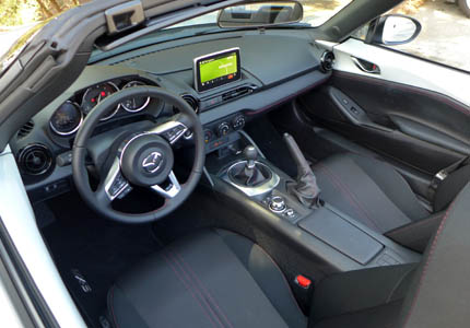 The interior of the 2016 Mazda MX-5 Miata boasts stylish touches and advanced technology