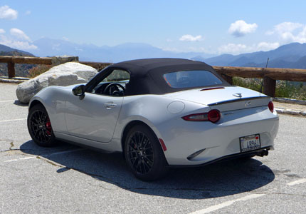 A rear view of the 2016 Mazda MX-5 Miata with the top up