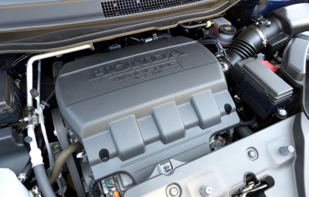 The 3.5-liter V6 engine inside the 2015 Honda Odyssey 5-Door Touring Elite