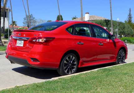 A three-quarter rear view of a 2016 Nissan Sentra SR