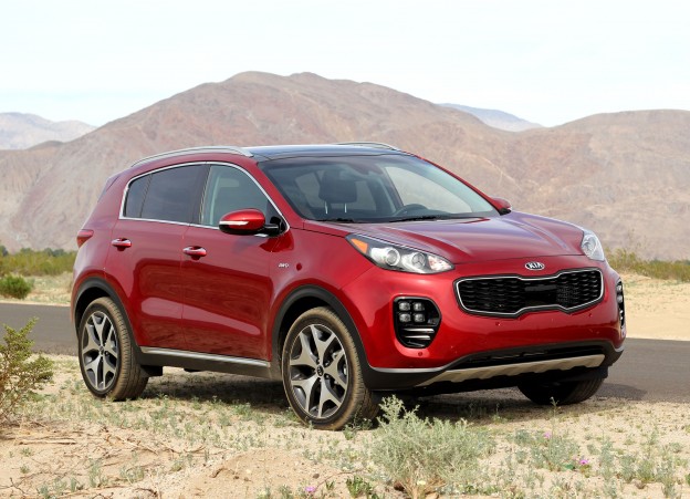 A three-quarter front view of a 2017 Kia Sportage SX AWD shown in Hyper Red