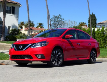 A three-quarter front view of a 2016 Nissan Sentra SR shown in Red Alert