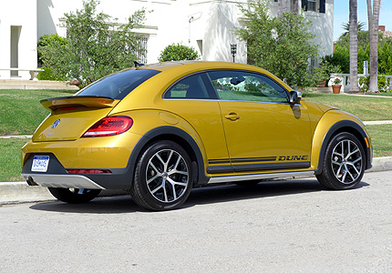 A three-quarter rear view of a 2016 Volkswagen Beetle Dune